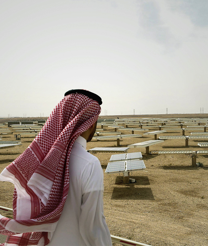 man-looking-at-solar-panels-in-petrostate-saudi-arabia
